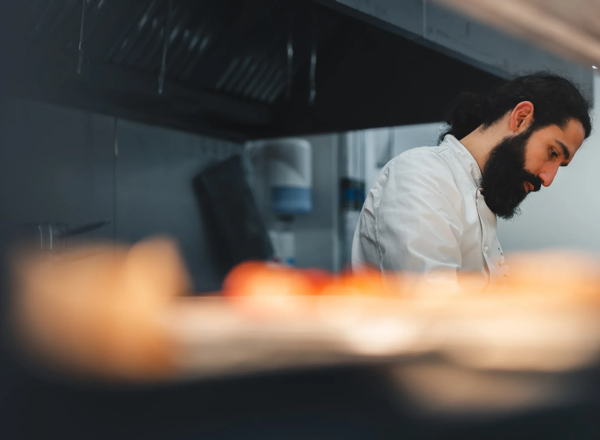 Chef preparing food in a professional kitchen — Escapade Silverstone content production