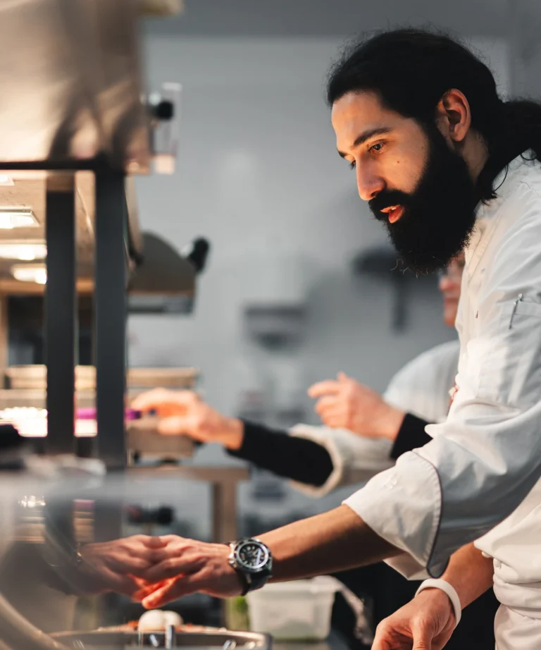 Chef plating at the pass — Escapade Silverstone behind-the-scenes content