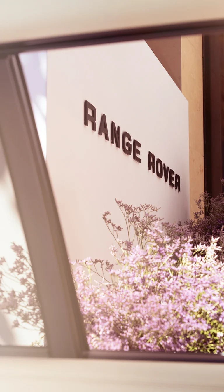 Range Rover sign and floral arrangement outside Wimbledon hospitality suite