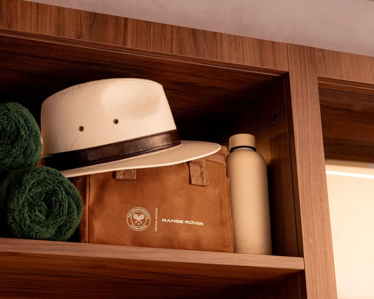 Range Rover Wimbledon suite shelf styling — branded luxury hospitality setup