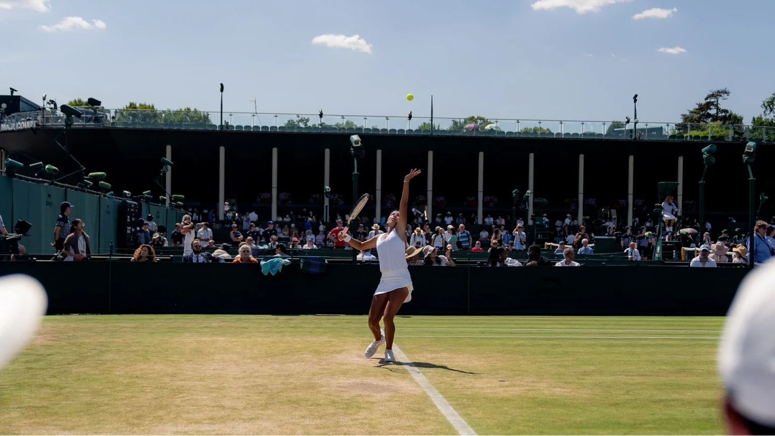 Tennis player serving on Centre Court — Wimbledon social content still